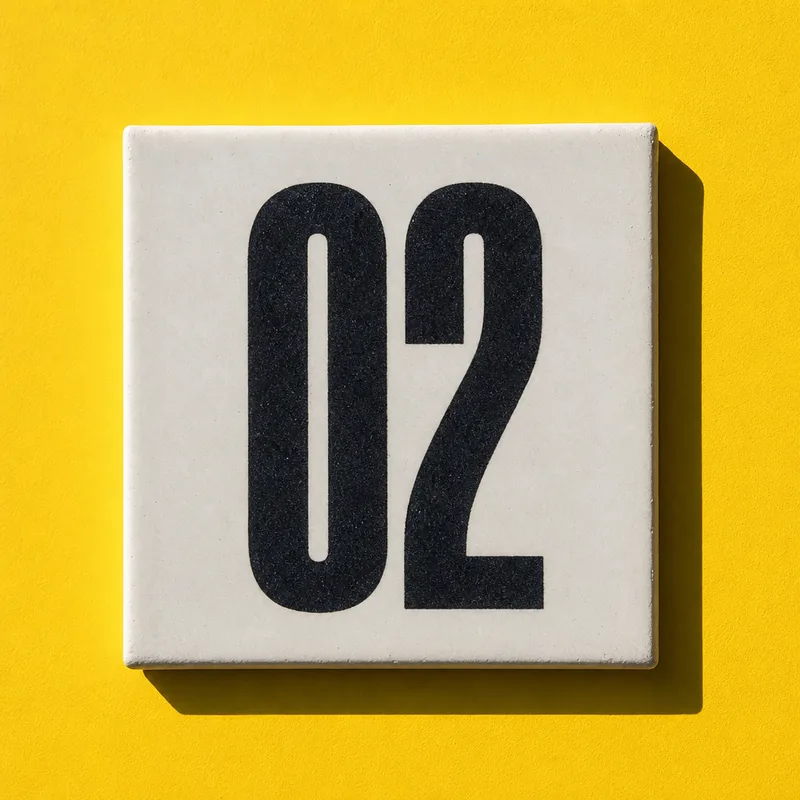 Ceramic tile numbered 02 on chrome yellow